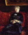 Frau sitzt auf einem roten Flowered Sofa Gustave Caillebotte